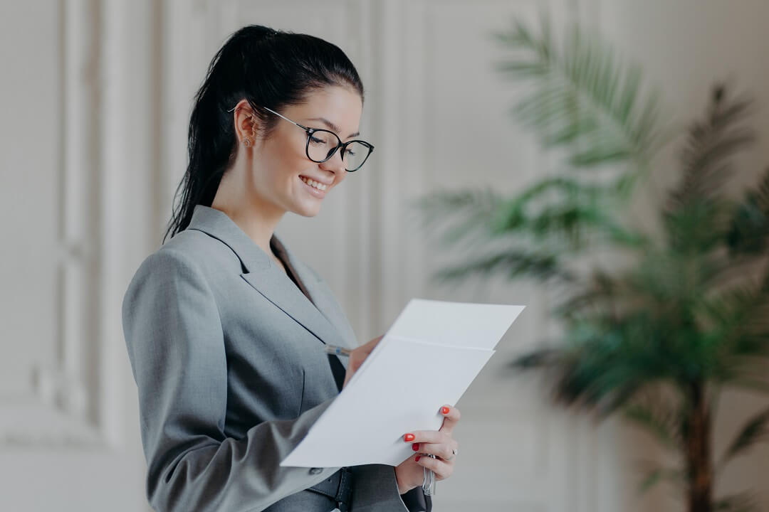 Female agent writing on a paper document